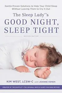 A baby sleeping in bed with the cover of the book